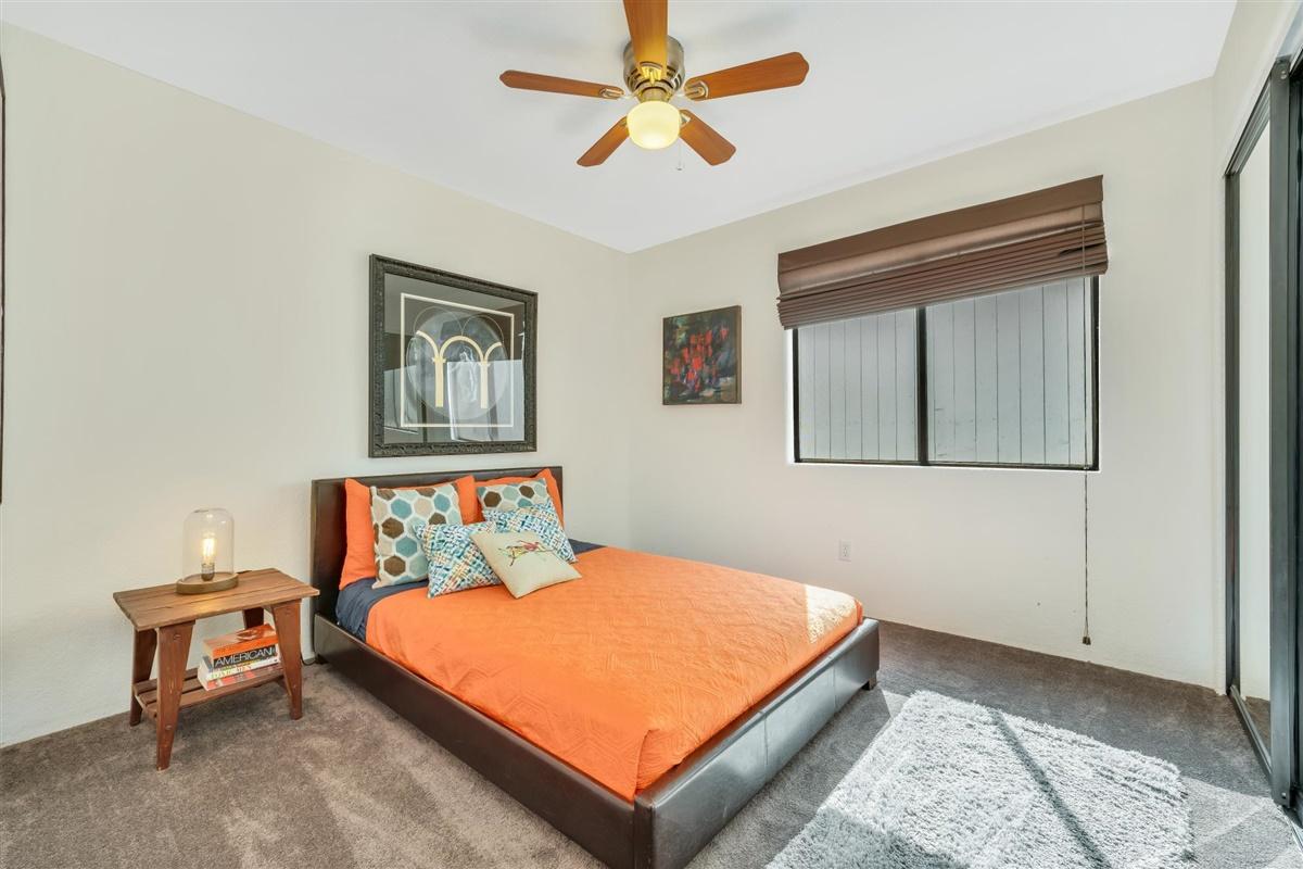 52695 Avenida Bermudas La Quinta, CA 92253 - Photo 36 of 49 a bedroom with a bed and a chandelier