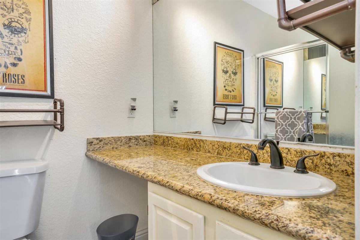 52695 Avenida Bermudas La Quinta, CA 92253 - Photo 37 of 49 a bathroom with a granite countertop sink and a mirror