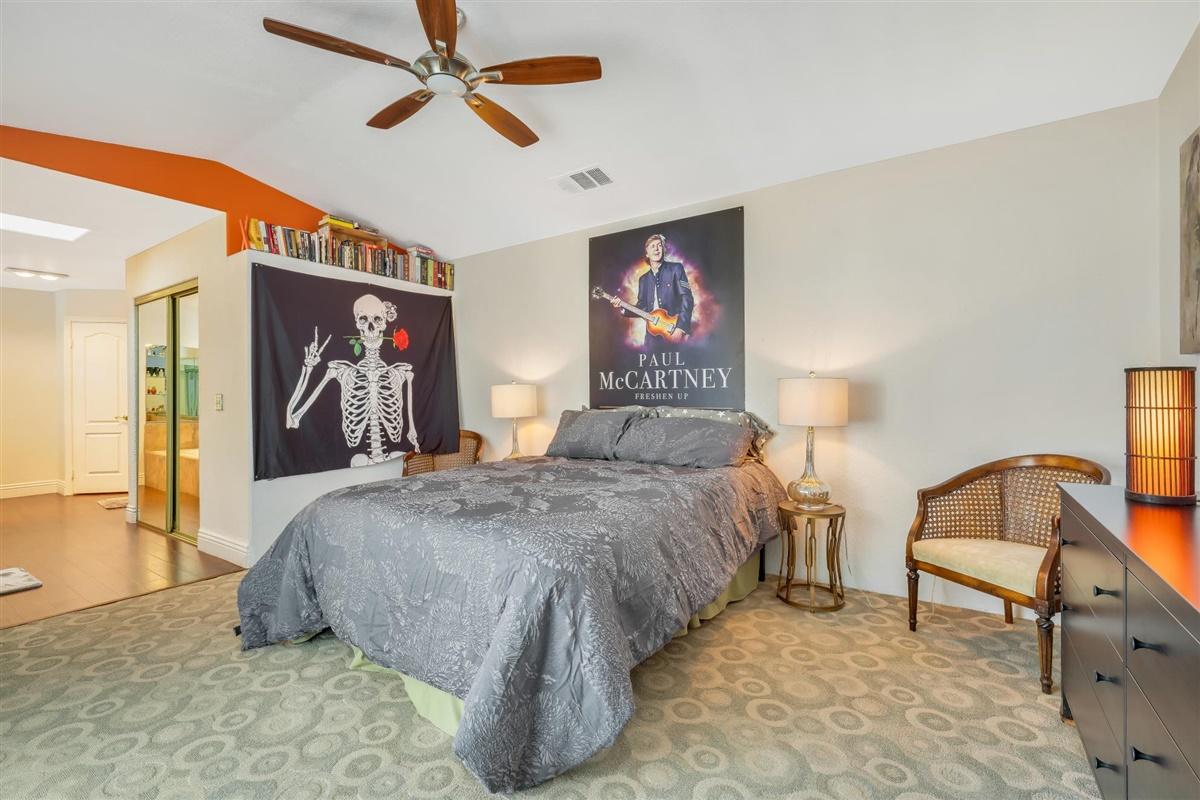 52695 Avenida Bermudas La Quinta, CA 92253 - Photo 39 of 49 a bedroom with a bed and a chandelier