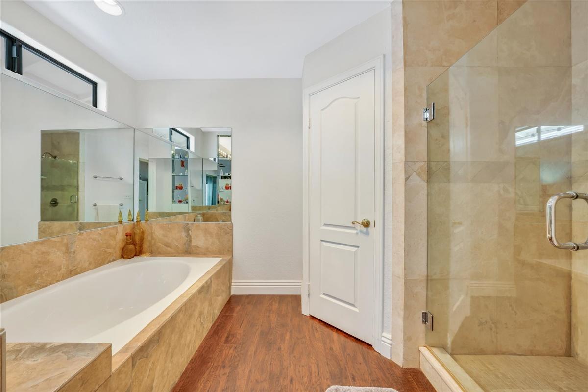 52695 Avenida Bermudas La Quinta, CA 92253 - Photo 42 of 49 a bathroom with a tub shower and sink