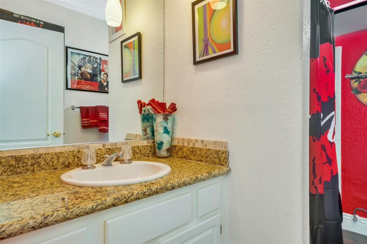 52695 Avenida Bermudas La Quinta, CA 92253 - Photo 44 of 49 a bathroom with a granite countertop sink and a mirror