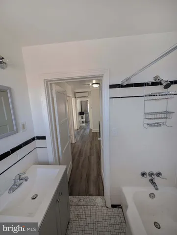 a bathroom with a sink and a tub