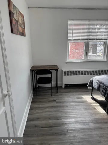 a view of a livingroom with furniture and staircase