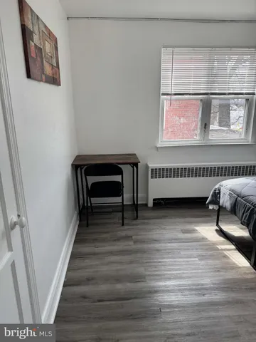 a view of a livingroom with furniture and staircase