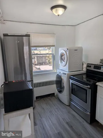 a kitchen with a stove and a microwave