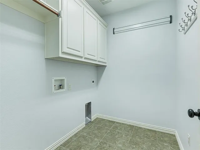 a view of storage and utility room with empty racks