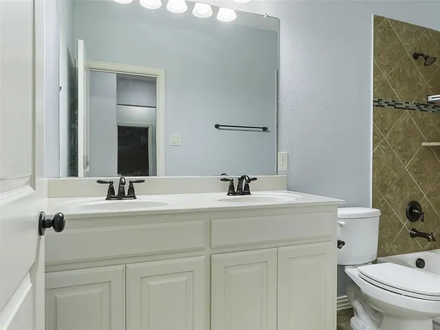 a bathroom with a sink and a toilet