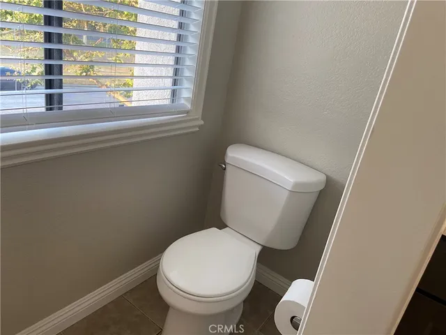 a bathroom with a sink a toilet and vanity