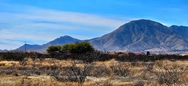 a view of lake and mountain in the background