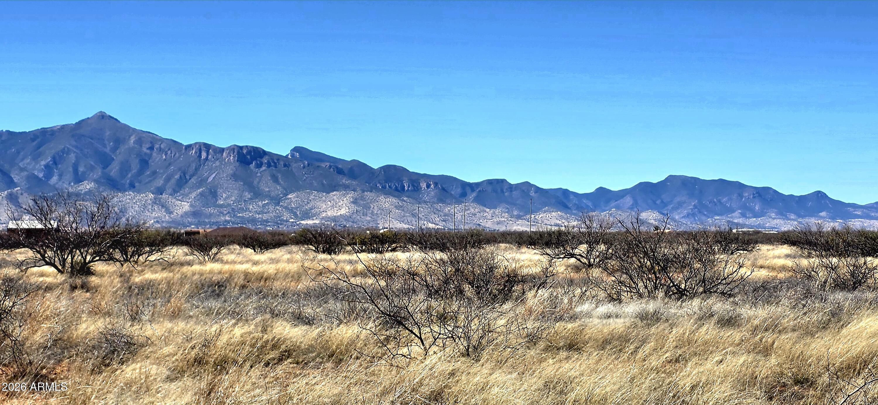 8254 South Airstrip Road, Unit 14 Hereford, AZ 85615 - Photo 3 of 7 a view of lake and mountain in the background