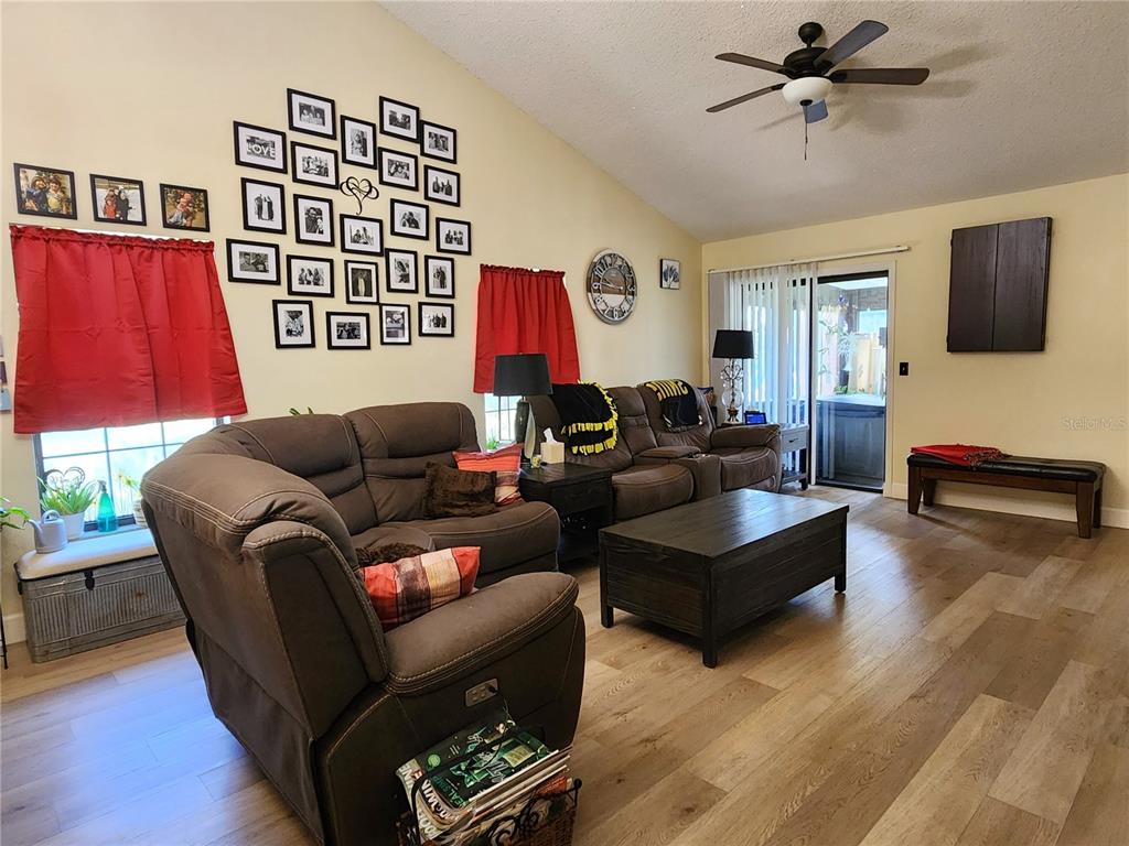 1701 Southeast 24th Road, Unit 1601 Ocala, FL 34471 - Photo 4 of 30 a living room with furniture a window and a flat screen tv