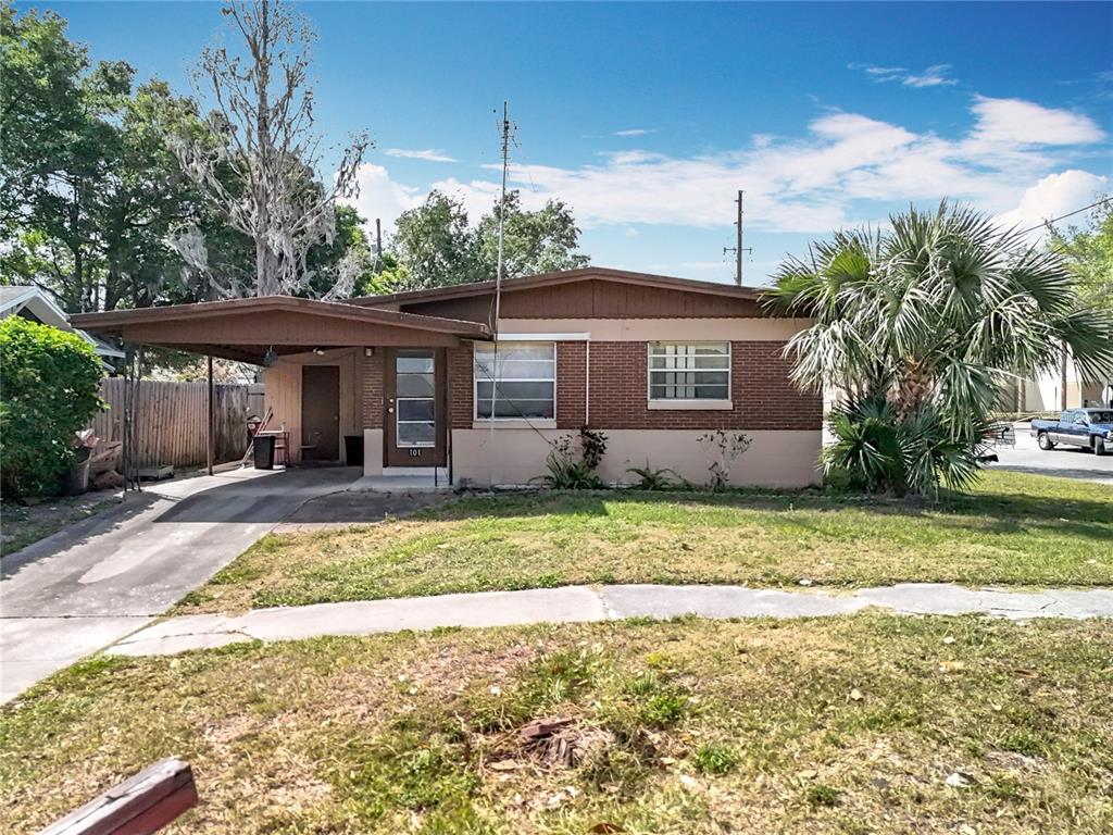 103 Lafayette Street Ocoee, FL 34761 - Photo 1 of 1 a view of a house with a yard and potted plants