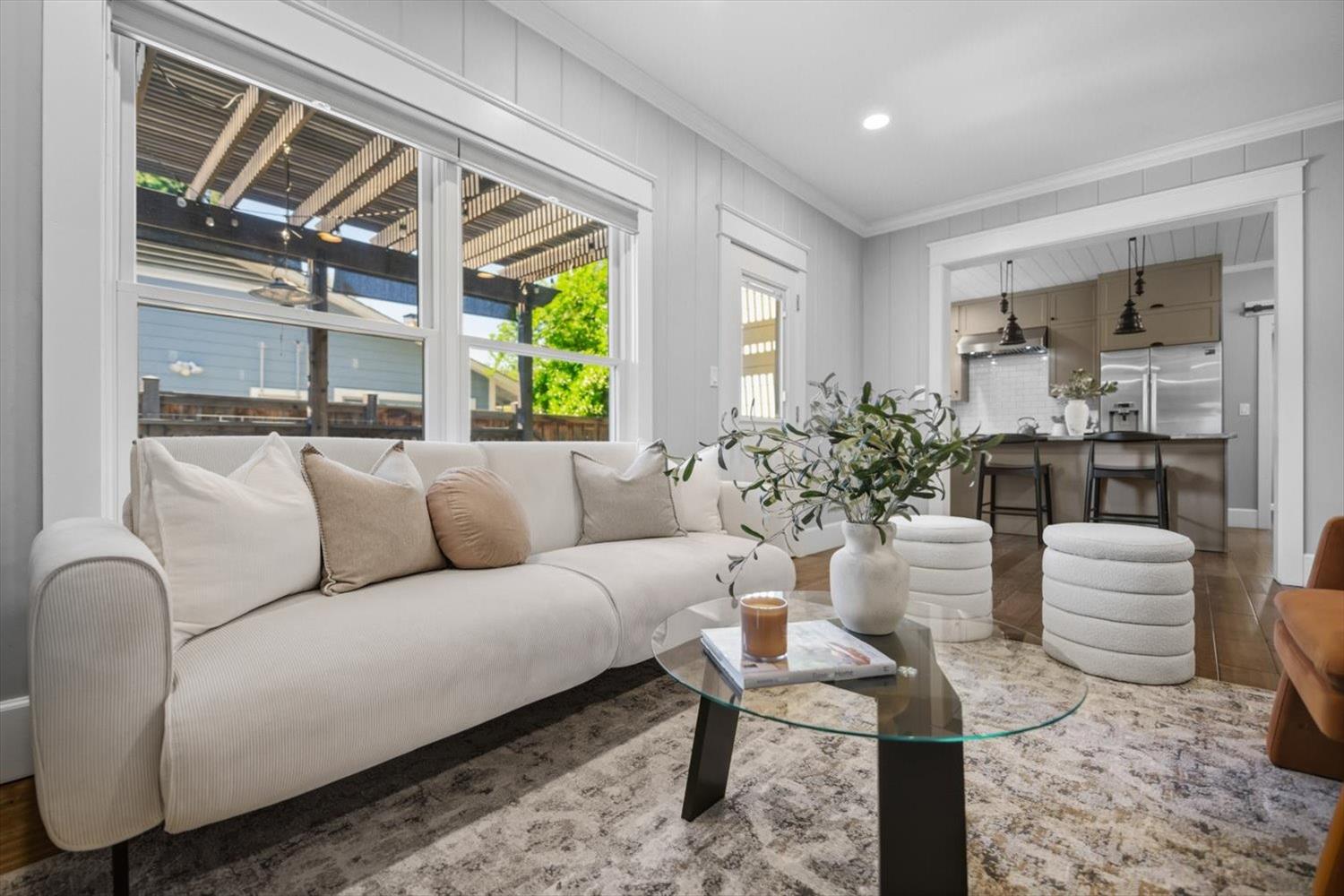 1121 4th Street Davis, CA 95616 - Photo 12 of 40 a living room with furniture a large window and plants