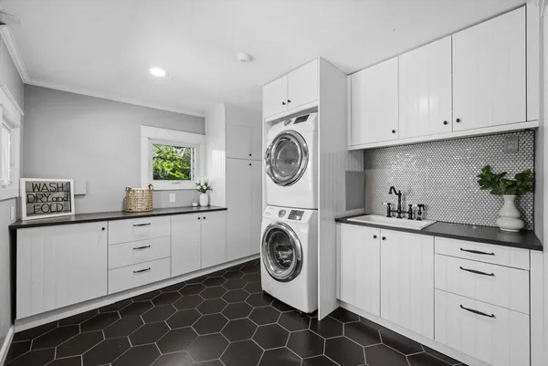 a view of empty room with window and hardwood