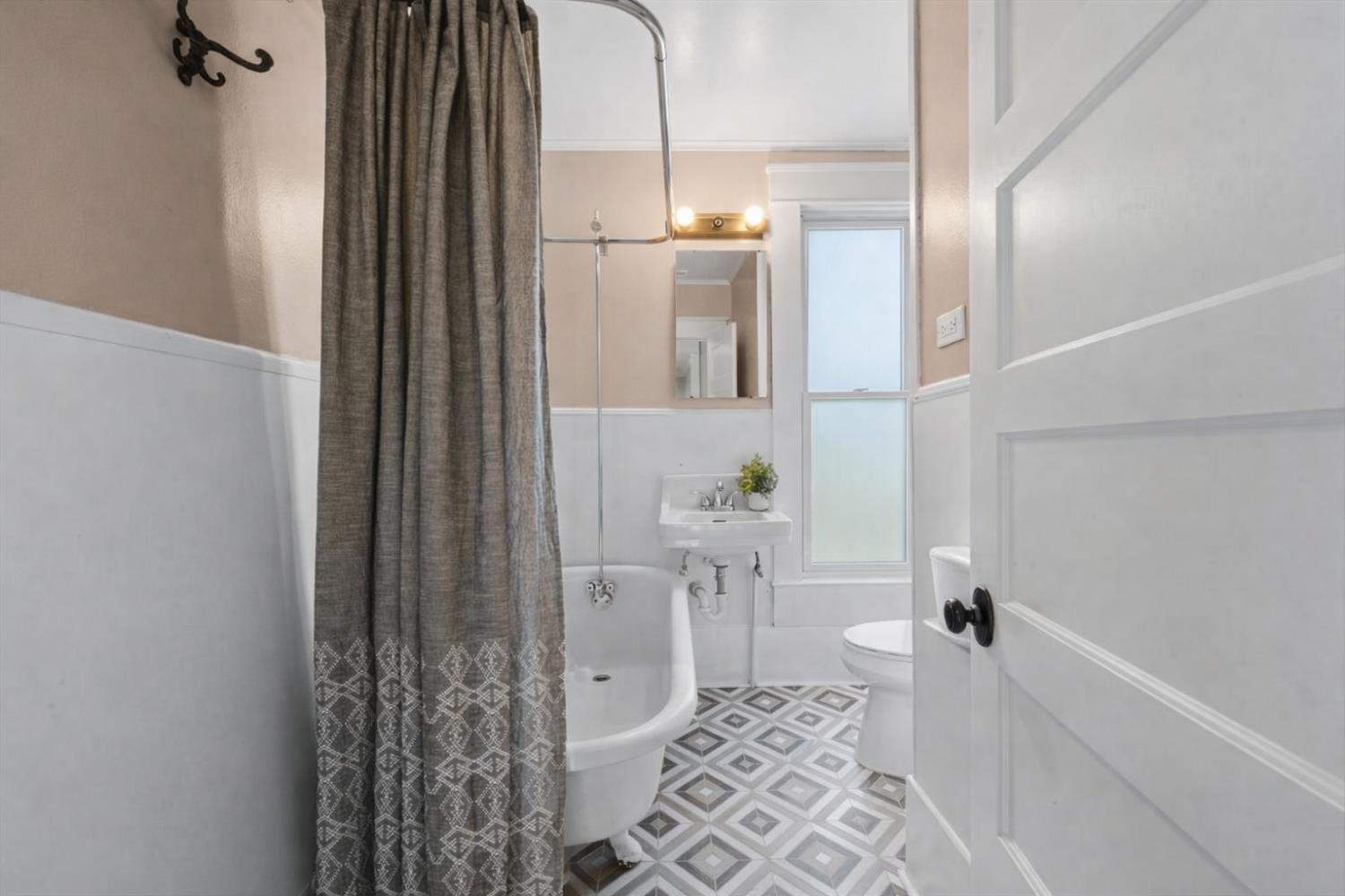1121 4th Street Davis, CA 95616 - Photo 30 of 40 a bathroom with a bathtub and shower