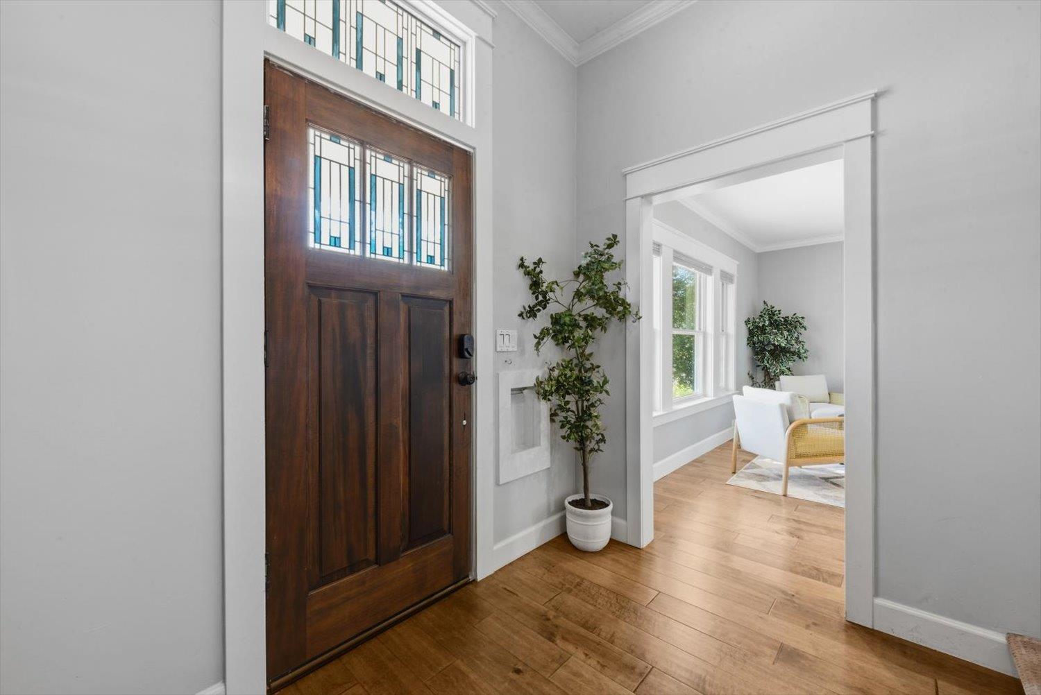 1121 4th Street Davis, CA 95616 - Photo 8 of 40 a view of an entryway with wooden floor and a livingroom