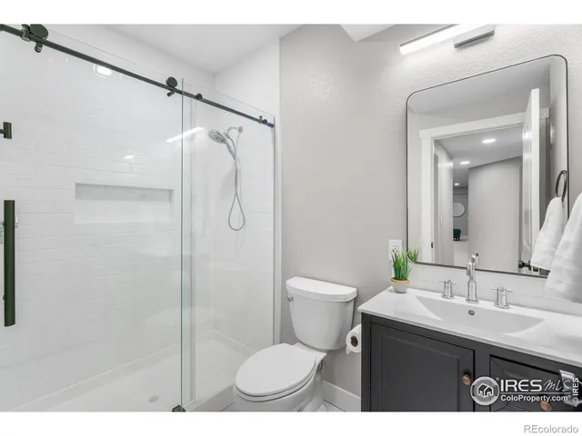 a view of a livingroom with a lounge chair