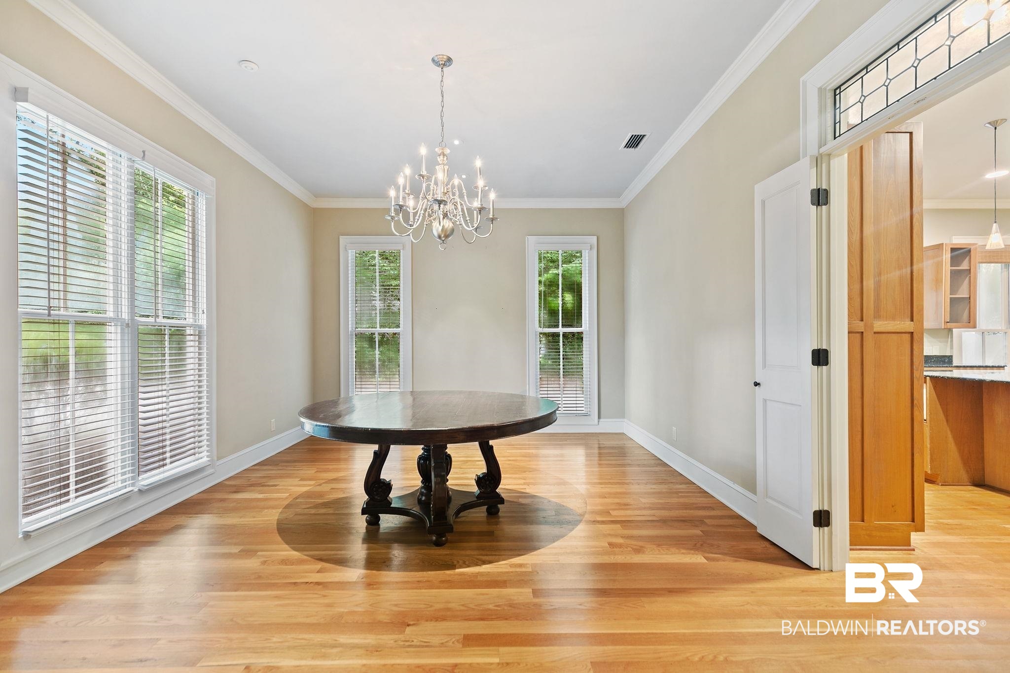 202 Beall Lane Daphne, AL 36526 - Photo 13 of 46 Dining space with crown molding, light hardwood / wood-style flooring, and plenty of natural light