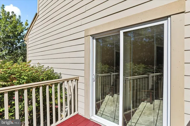 a bathroom with a sink vanity mirror and toilet