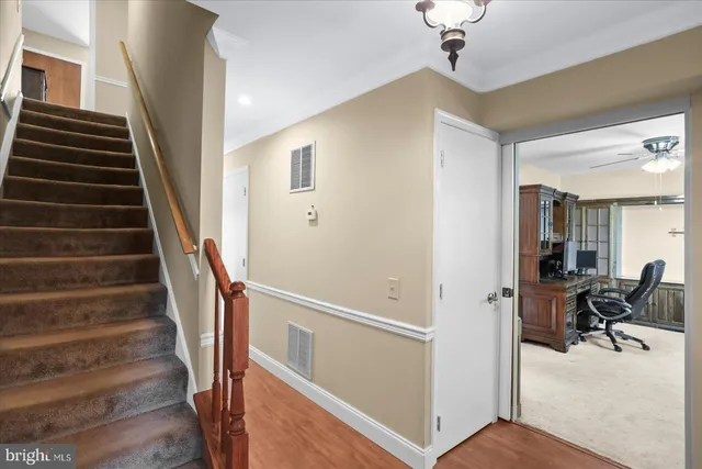 a white toilet sitting next to a bathroom sink
