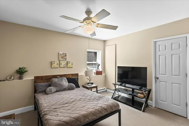 a view of a big house with a big yard and large trees