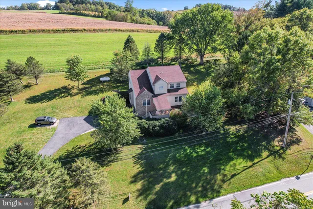 an aerial view of house with yard swimming pool and outdoor seating