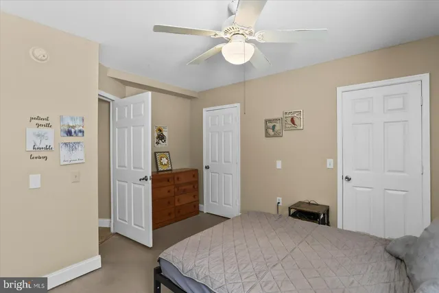 a view of a large house with a big yard and large trees