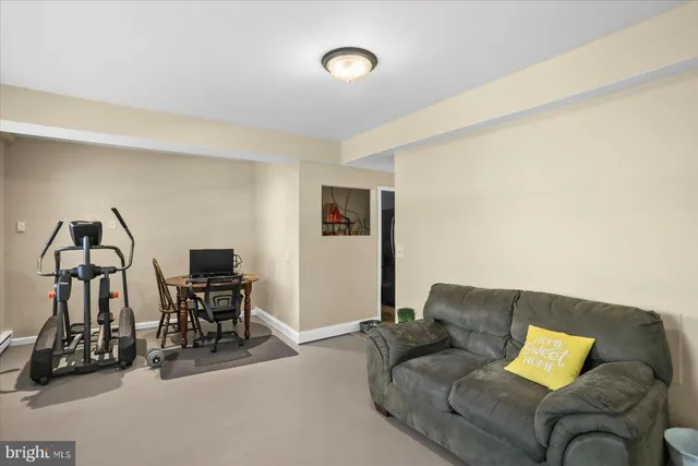 a view of a patio with dining table and chairs