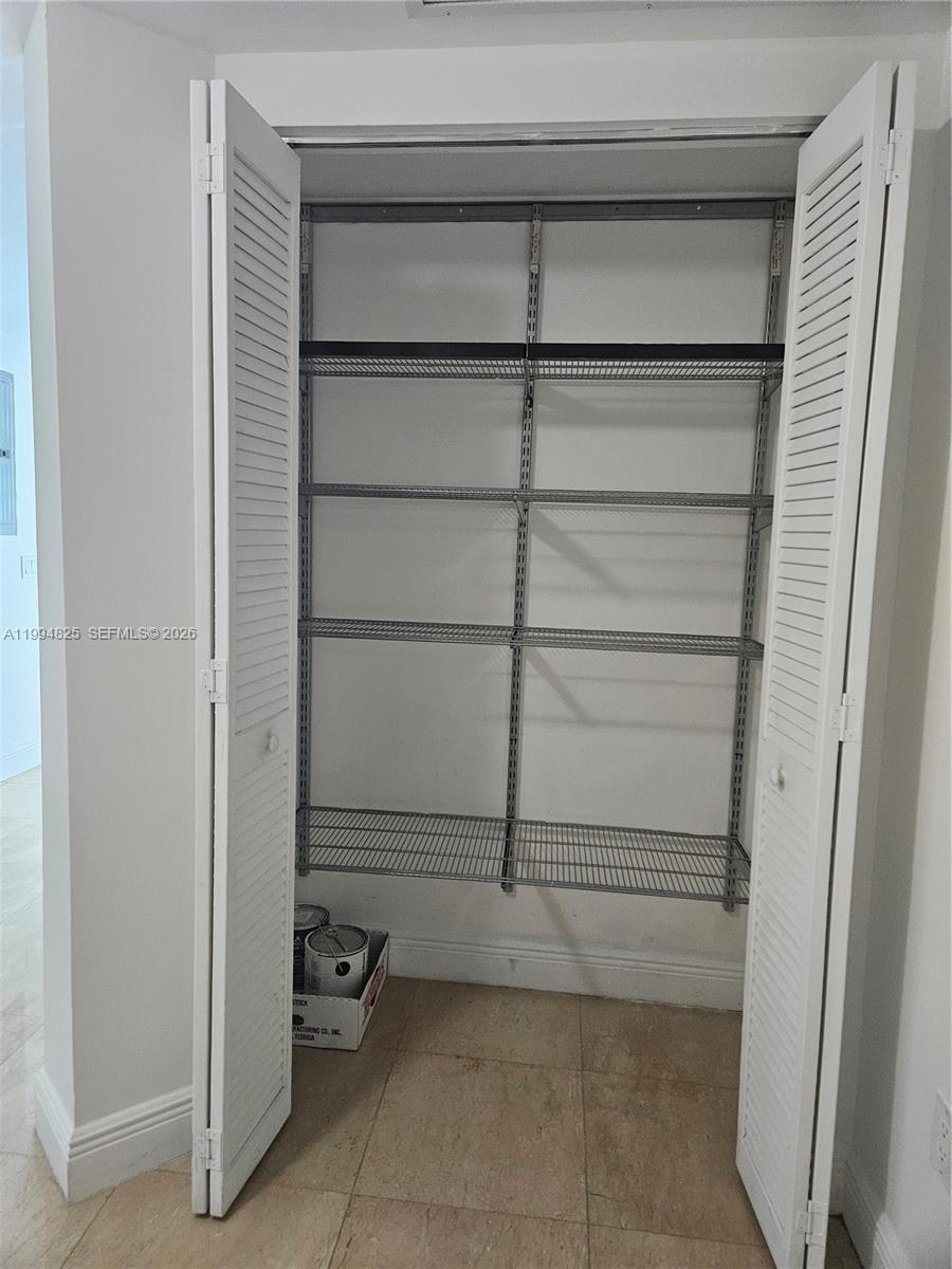 41 Southeast 5th Street, Unit 1517 Miami, FL 33131 - Photo 22 of 62 a view of an empty walk in closet