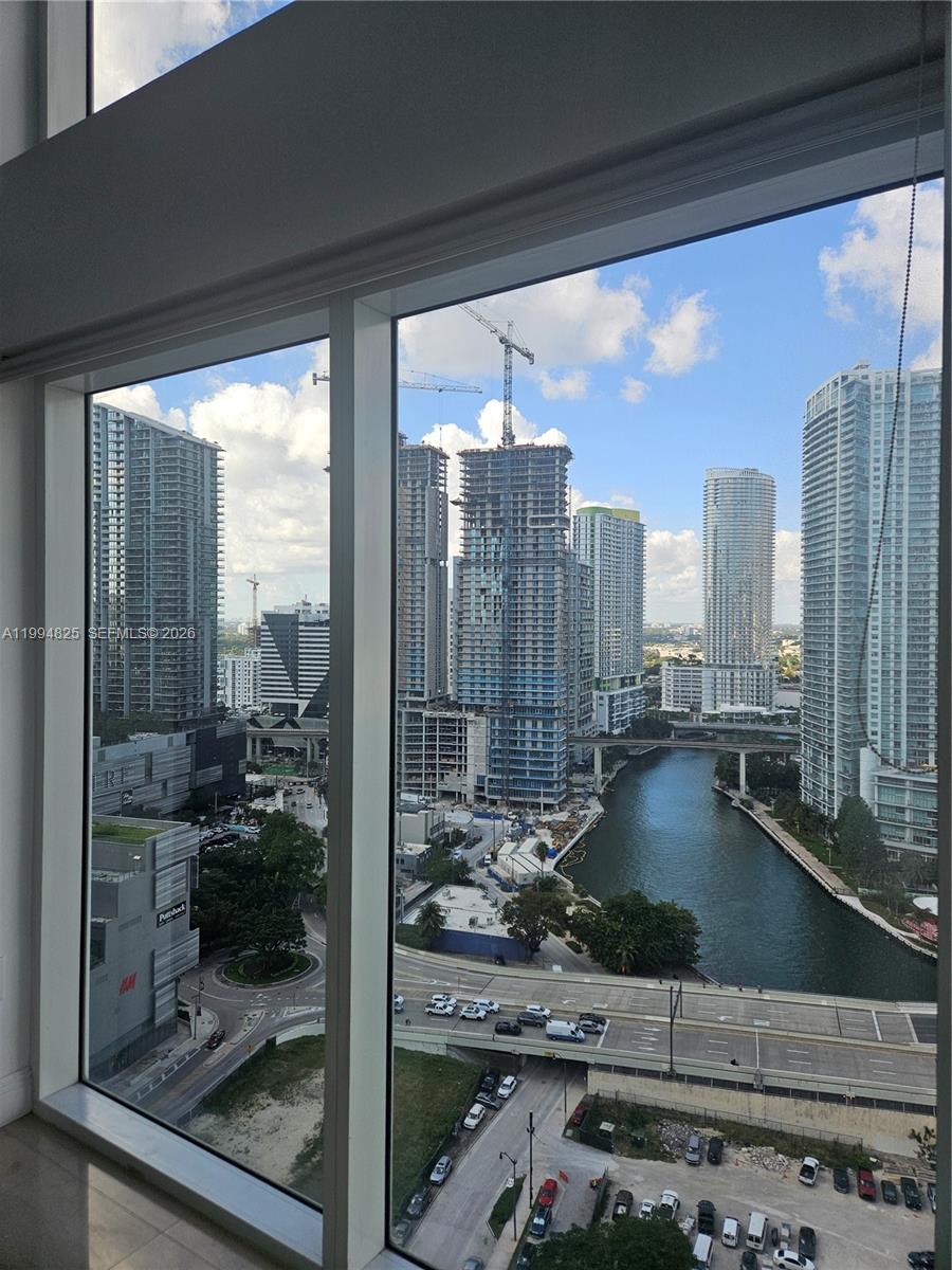 41 Southeast 5th Street, Unit 1517 Miami, FL 33131 - Photo 25 of 62 a view of a living room and floor to ceiling window