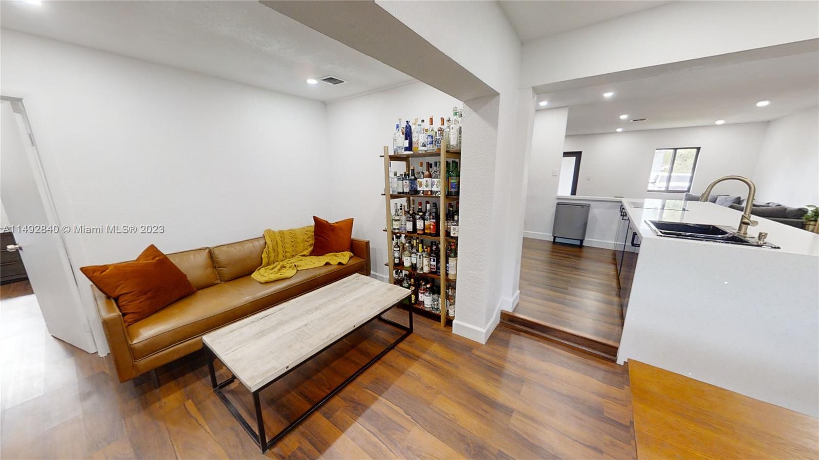 445 Southwest 62nd Court Miami, FL 33144 - Photo 16 of 49 a living room with furniture and wooden floor