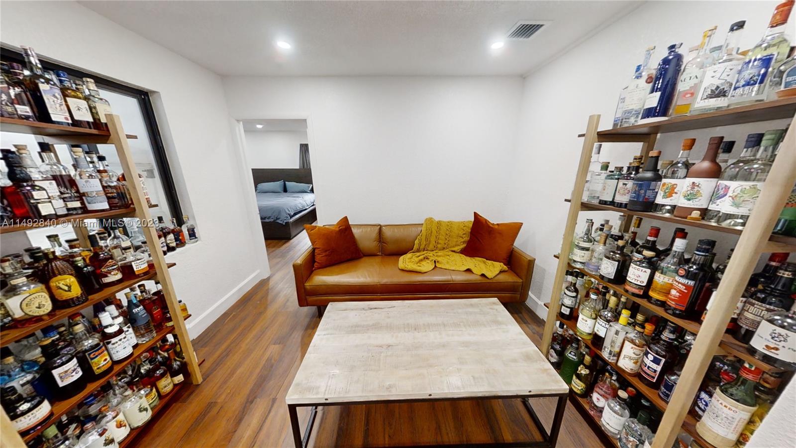 445 Southwest 62nd Court Miami, FL 33144 - Photo 17 of 49 a living room with lots of furniture and wooden floor