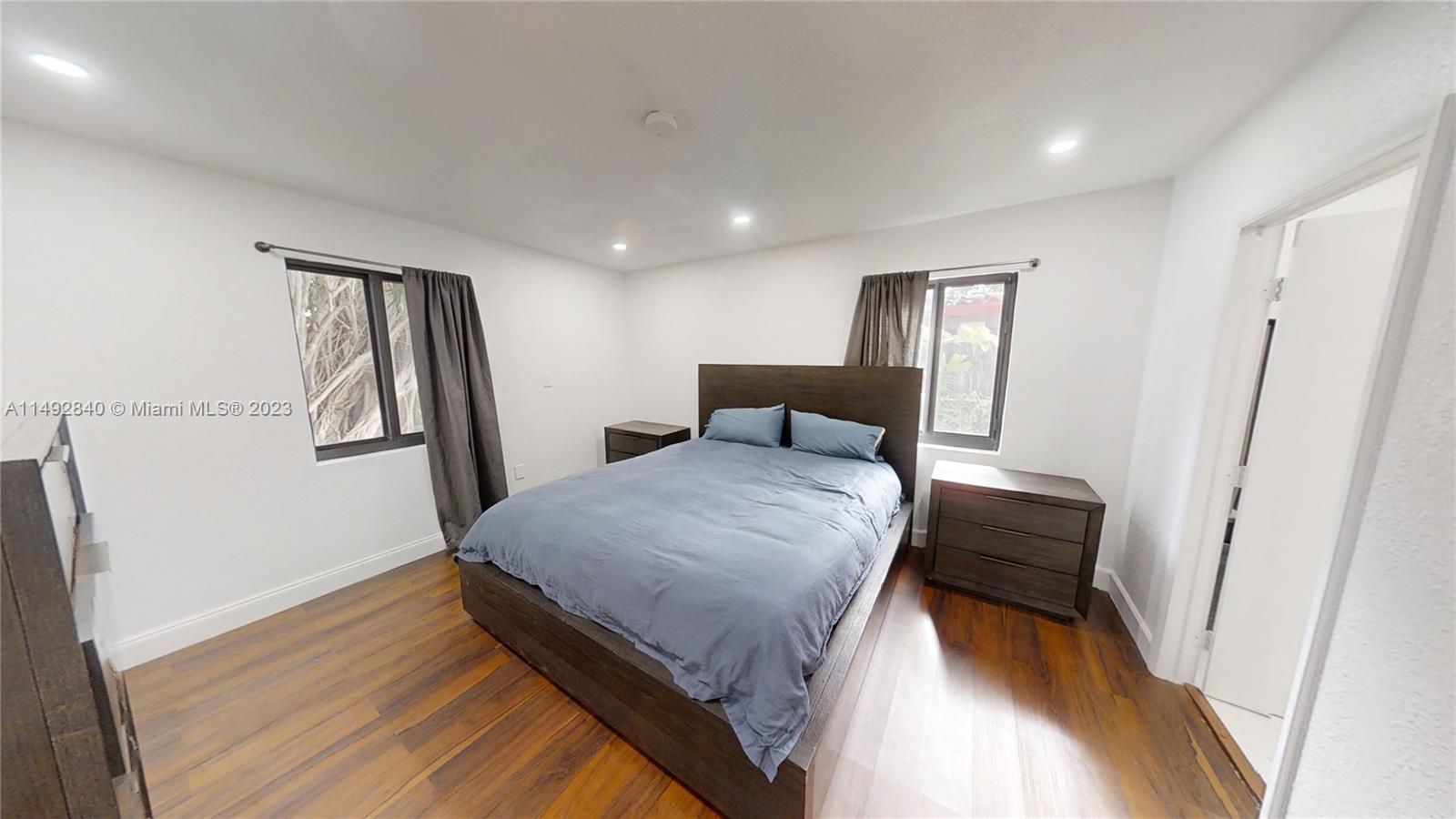 445 Southwest 62nd Court Miami, FL 33144 - Photo 19 of 49 a bedroom with a bed and a window