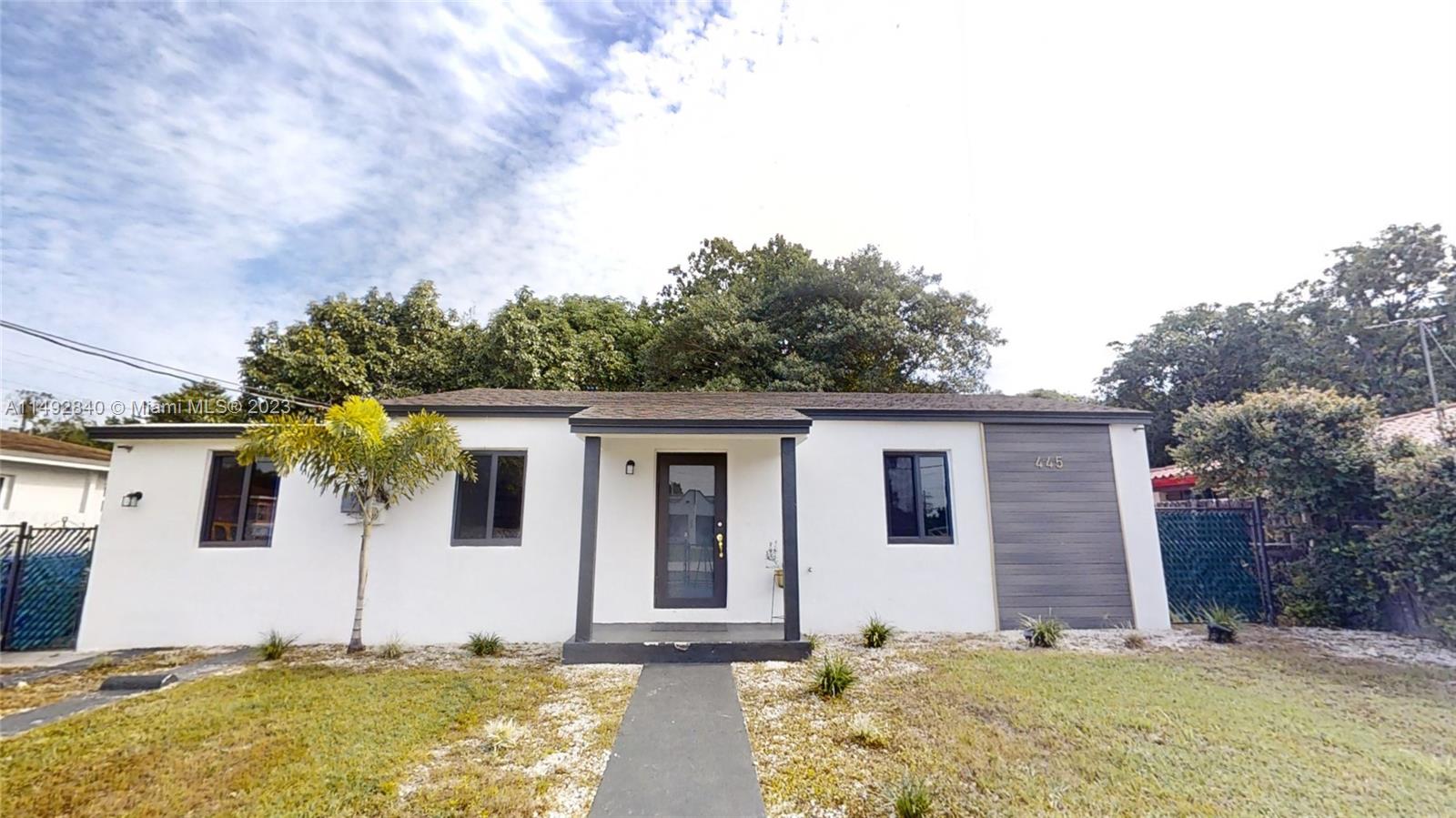 445 Southwest 62nd Court Miami, FL 33144 - Photo 2 of 49 a view of a house with backyard and tree