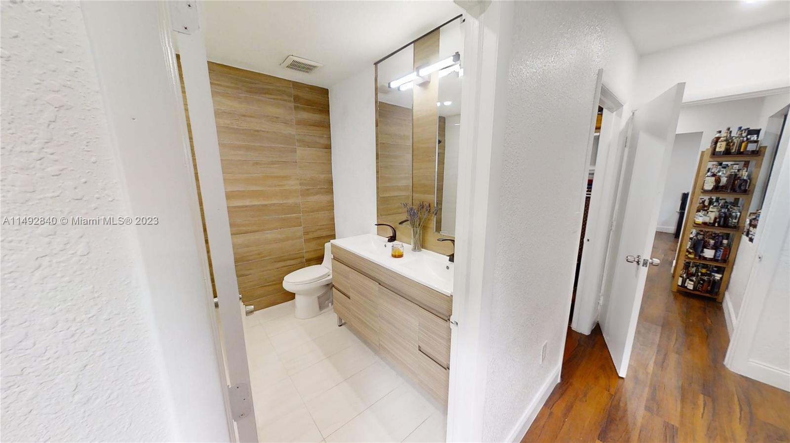 445 Southwest 62nd Court Miami, FL 33144 - Photo 22 of 49 a bathroom with a tub and shower