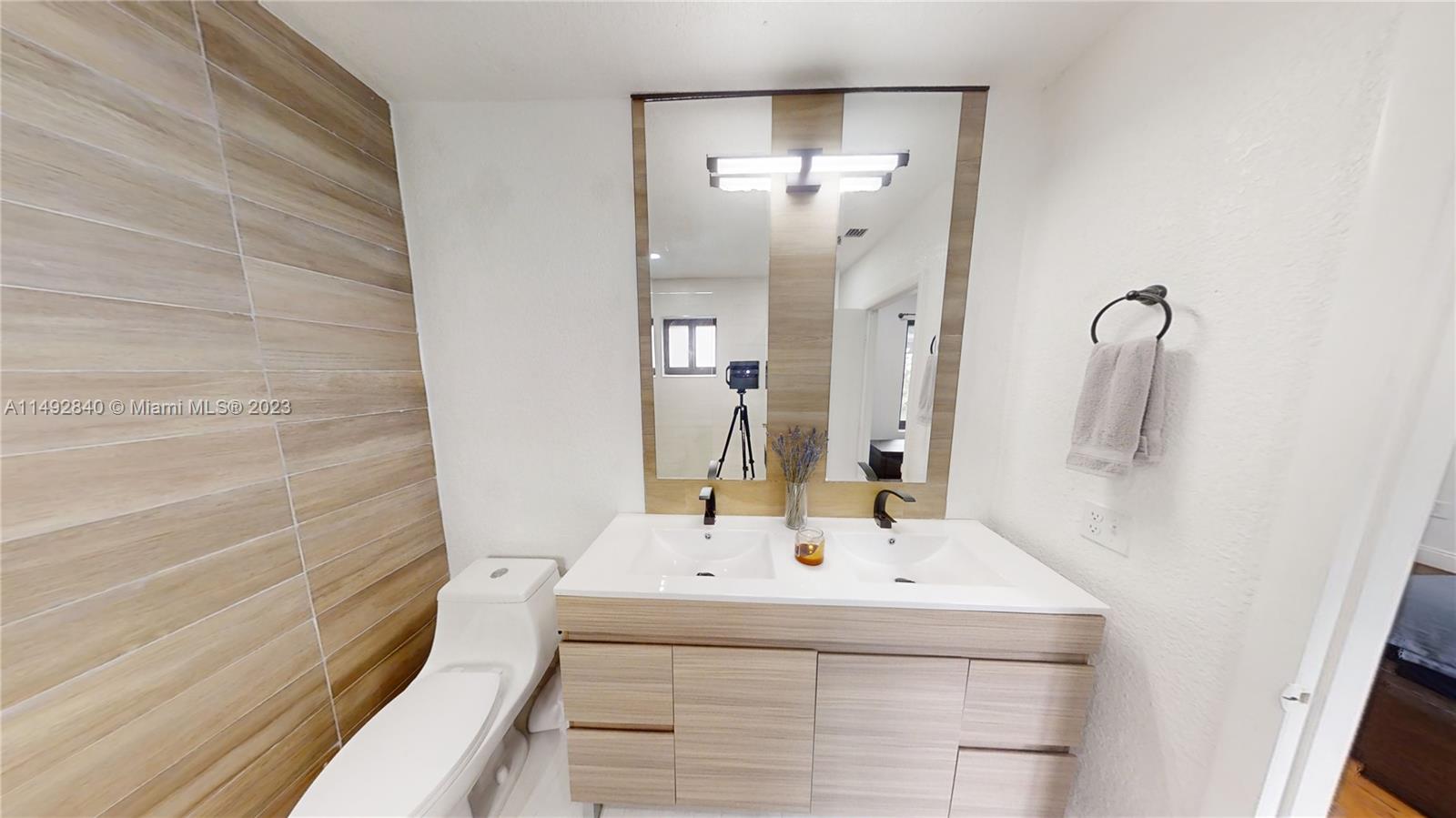 445 Southwest 62nd Court Miami, FL 33144 - Photo 24 of 49 a bathroom with a sink and a mirror