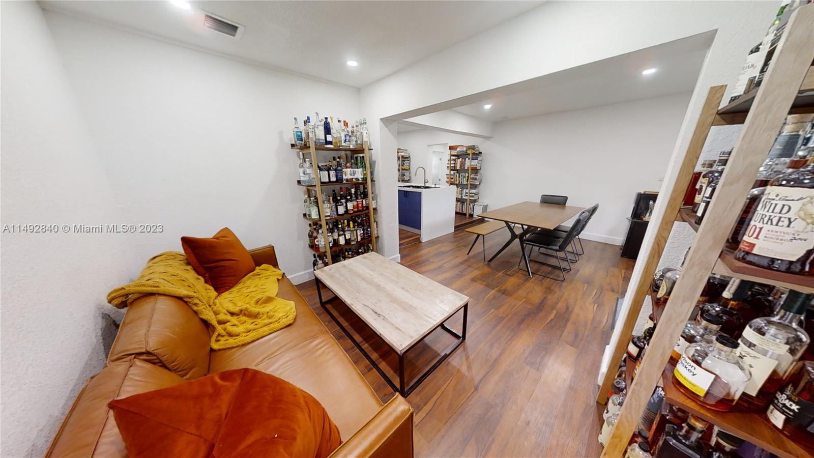 445 Southwest 62nd Court Miami, FL 33144 - Photo 27 of 49 a living room with furniture and wooden floor