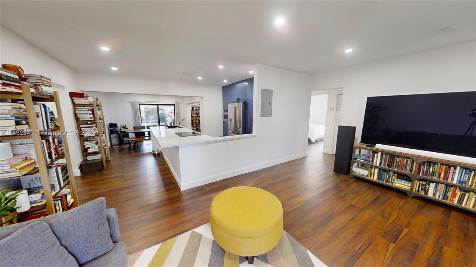 445 Southwest 62nd Court Miami, FL 33144 - Photo 29 of 49 a living room with furniture and a flat screen tv