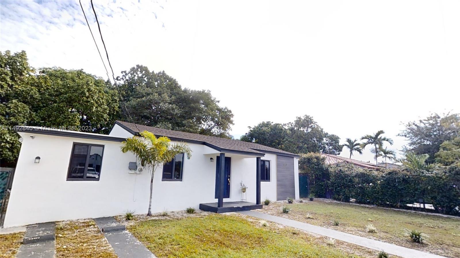 445 Southwest 62nd Court Miami, FL 33144 - Photo 3 of 49 a front view of house with yard