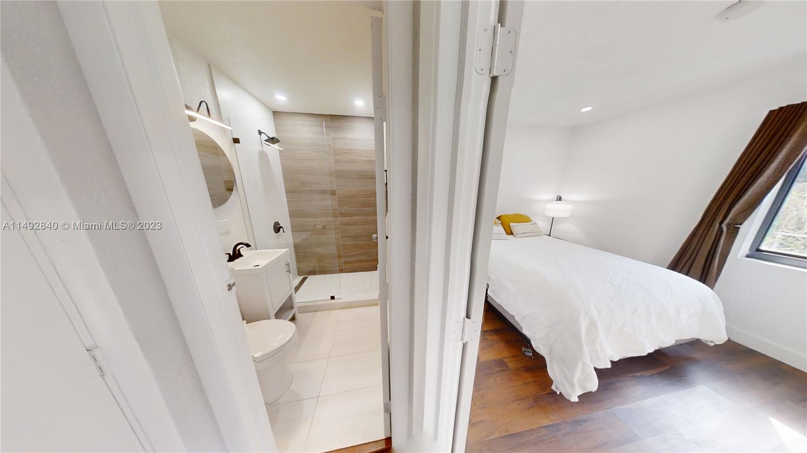 445 Southwest 62nd Court Miami, FL 33144 - Photo 33 of 49 a bathroom with a tub and shower