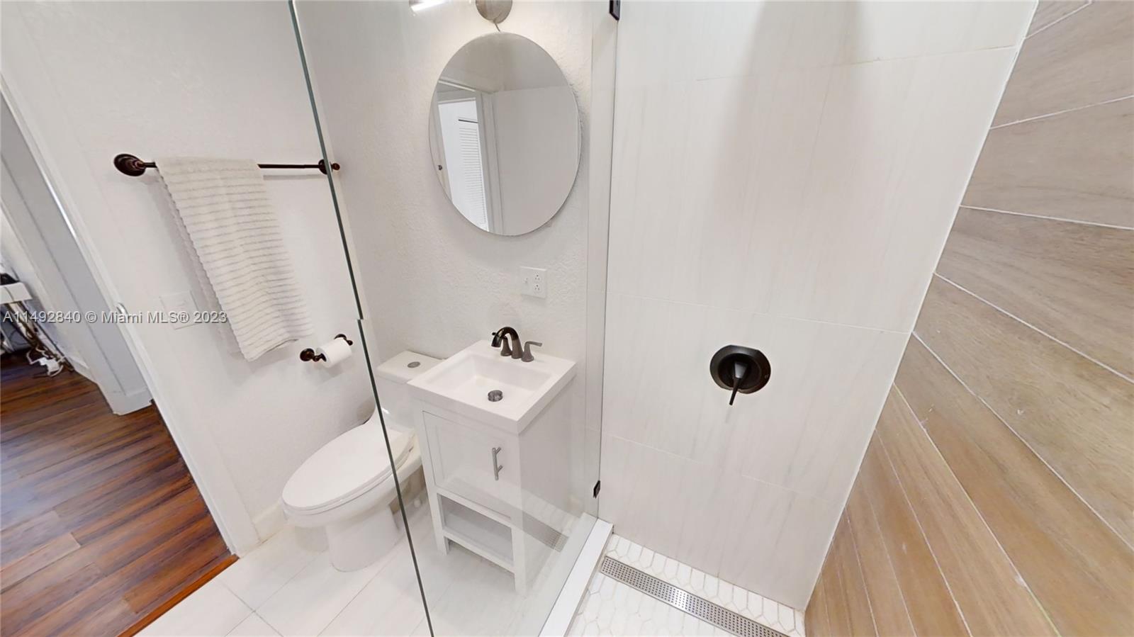 445 Southwest 62nd Court Miami, FL 33144 - Photo 35 of 49 a bathroom with a sink a toilet and shower