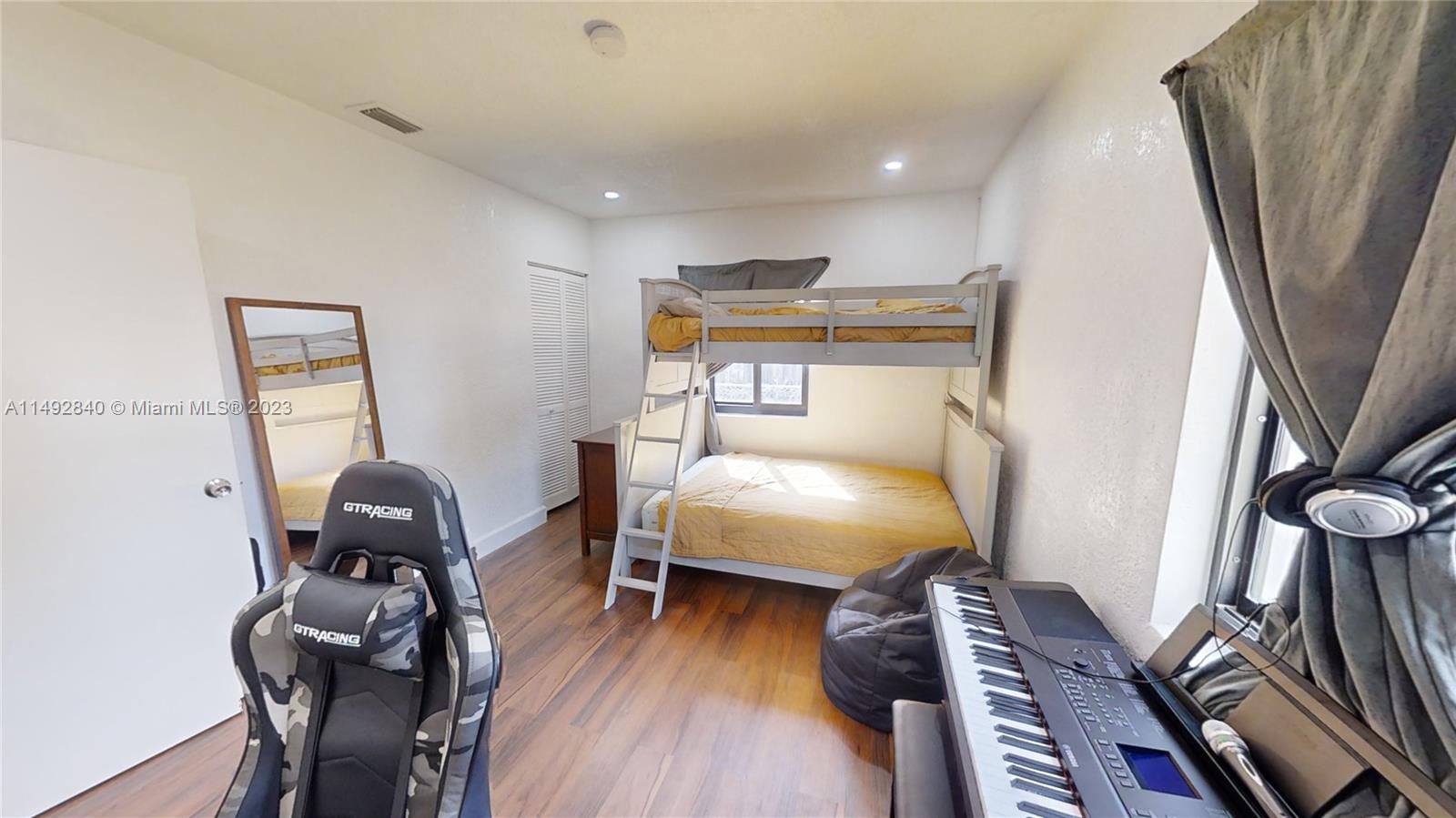 445 Southwest 62nd Court Miami, FL 33144 - Photo 37 of 49 a bedroom with furniture and a window