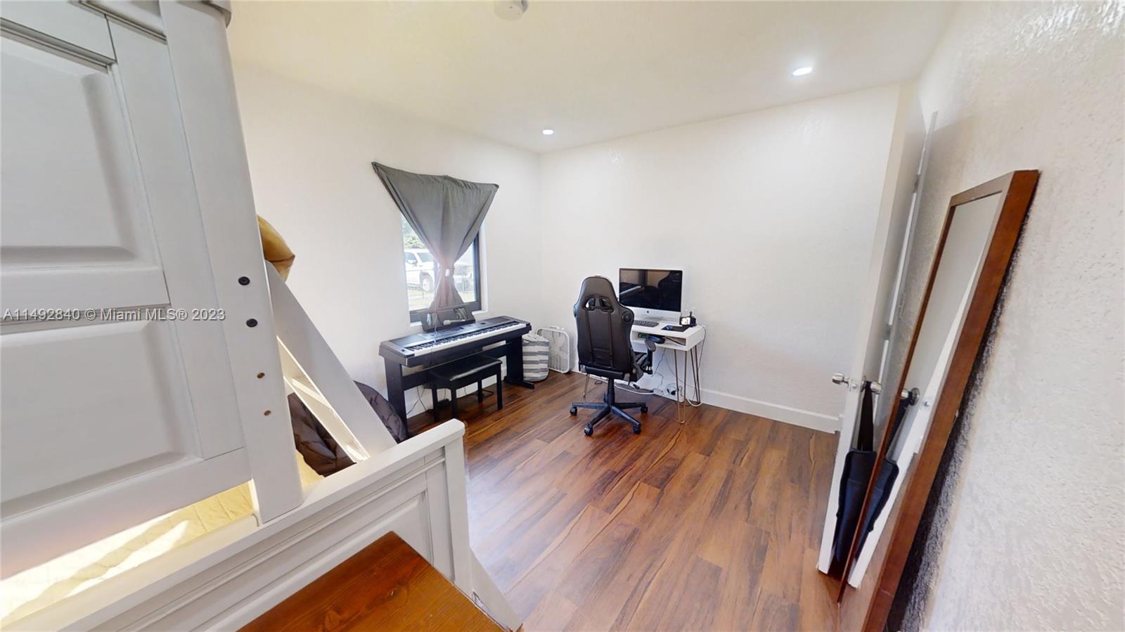 445 Southwest 62nd Court Miami, FL 33144 - Photo 39 of 49 a view of a workspace with furniture and a window