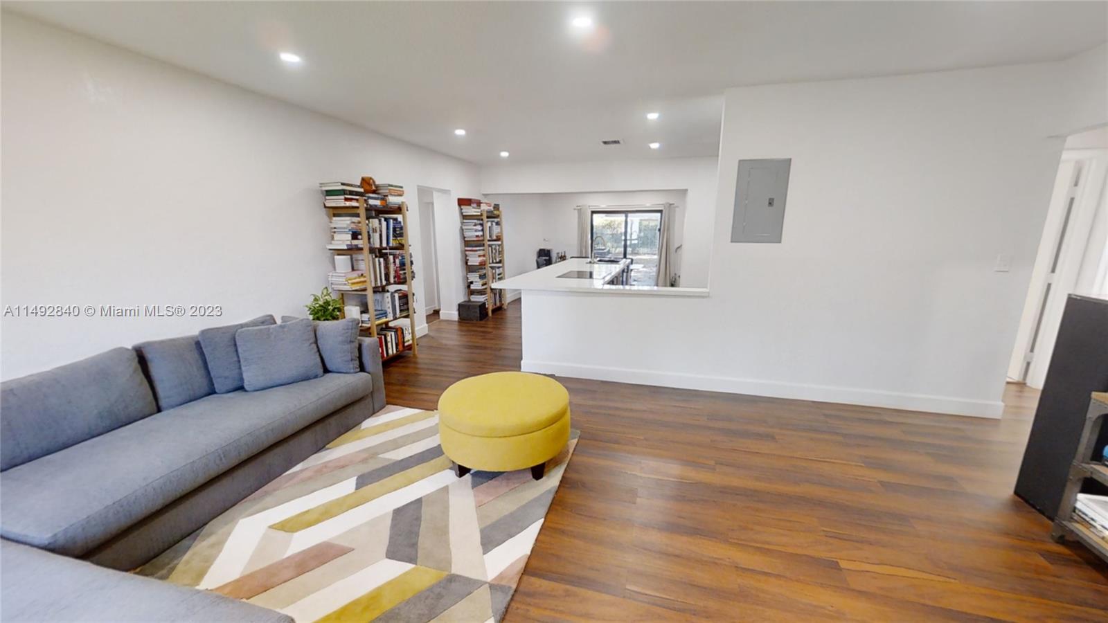 445 Southwest 62nd Court Miami, FL 33144 - Photo 4 of 49 a living room with furniture and a wooden floor