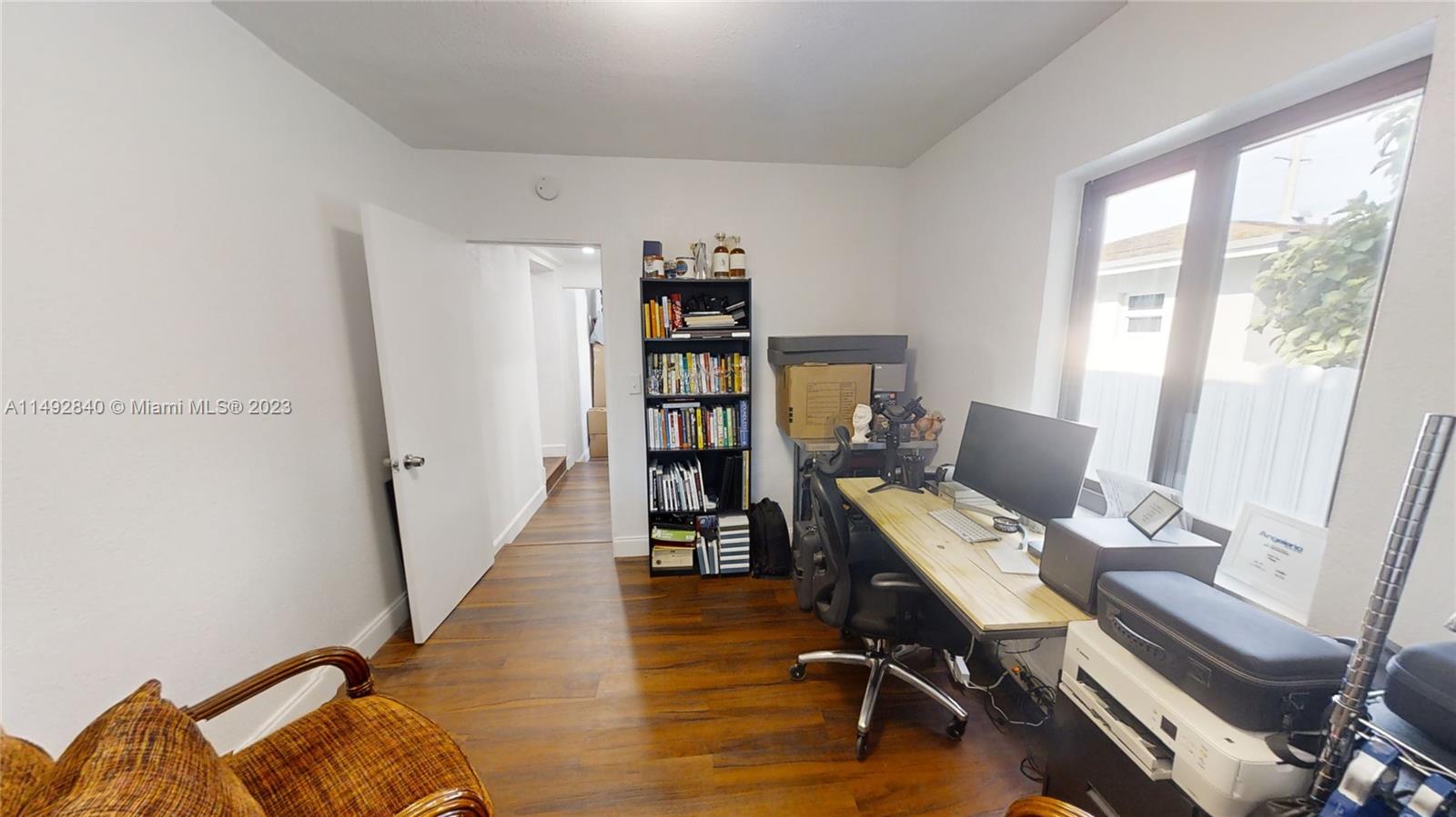 445 Southwest 62nd Court Miami, FL 33144 - Photo 42 of 49 a view of a workspace with furniture and a window