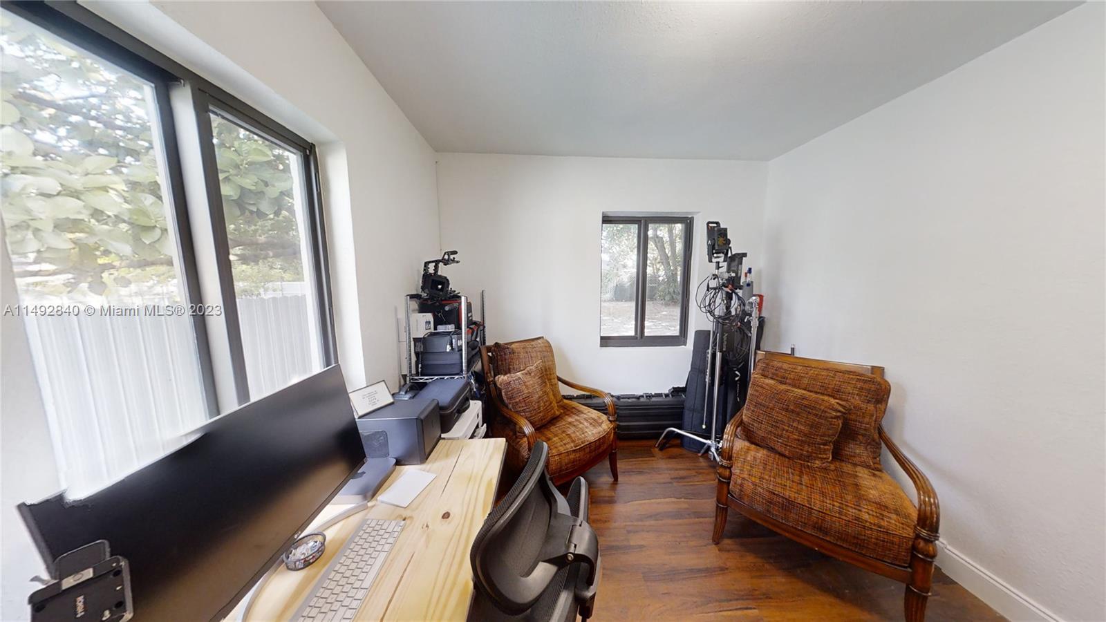 445 Southwest 62nd Court Miami, FL 33144 - Photo 43 of 49 a living room with furniture and a window