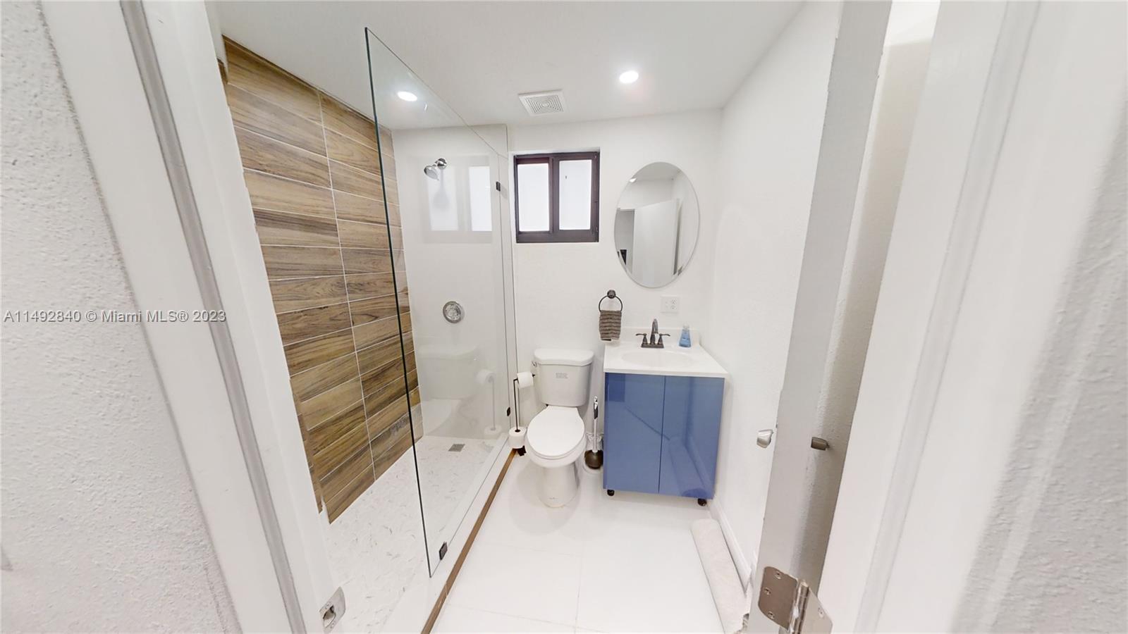 445 Southwest 62nd Court Miami, FL 33144 - Photo 44 of 49 a bathroom with a sink and a mirror