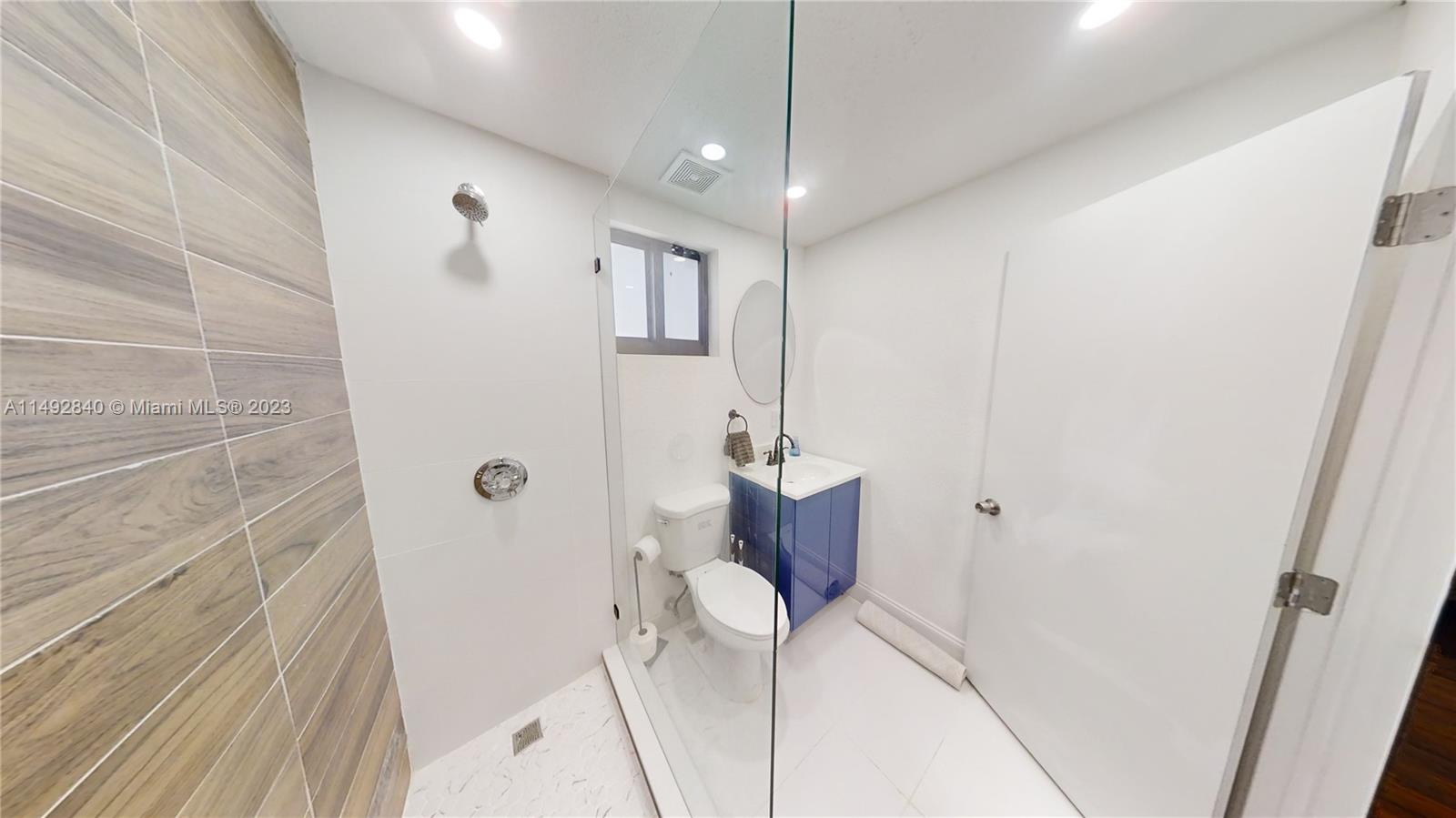 445 Southwest 62nd Court Miami, FL 33144 - Photo 46 of 49 a bathroom with a shower and a sink