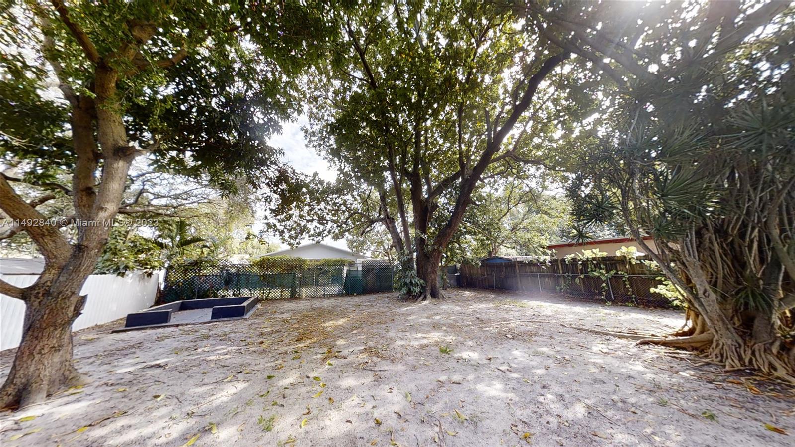 445 Southwest 62nd Court Miami, FL 33144 - Photo 48 of 49 a backyard of a house with lots of green space