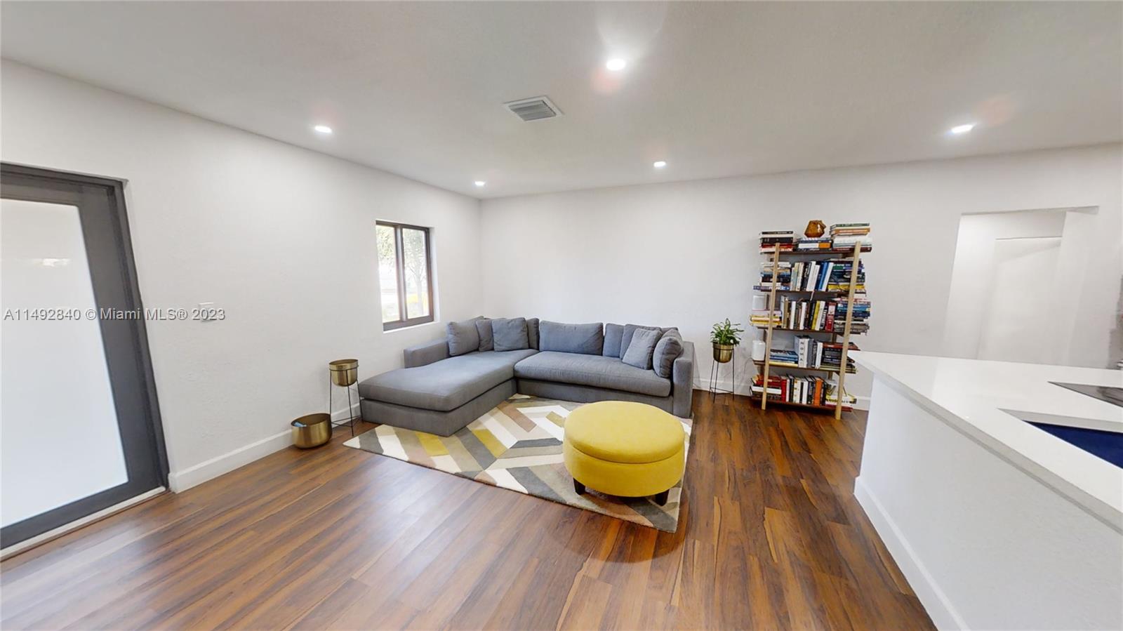 445 Southwest 62nd Court Miami, FL 33144 - Photo 5 of 49 a living room with furniture and a wooden floor